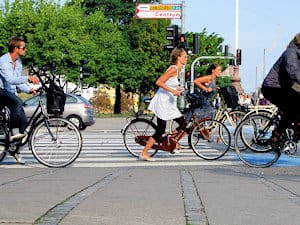 Cycling in Copenhagen: Where bicycles are used for more than 30% of utility journeys injury rates fall regardless of helmet use.