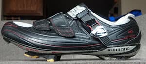 Road cleats protrude from the sole of the shoe making walking uncomfortable
